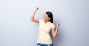 Woman celebrating after her boss implemented incentives for cleaning staff