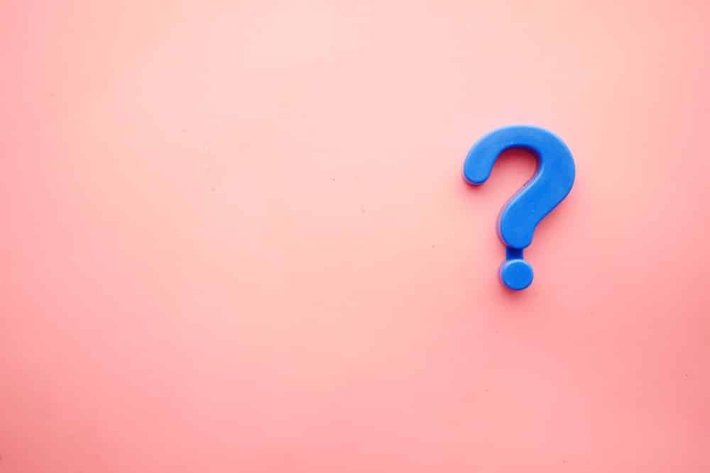 Graphic of blue question mark on pink background