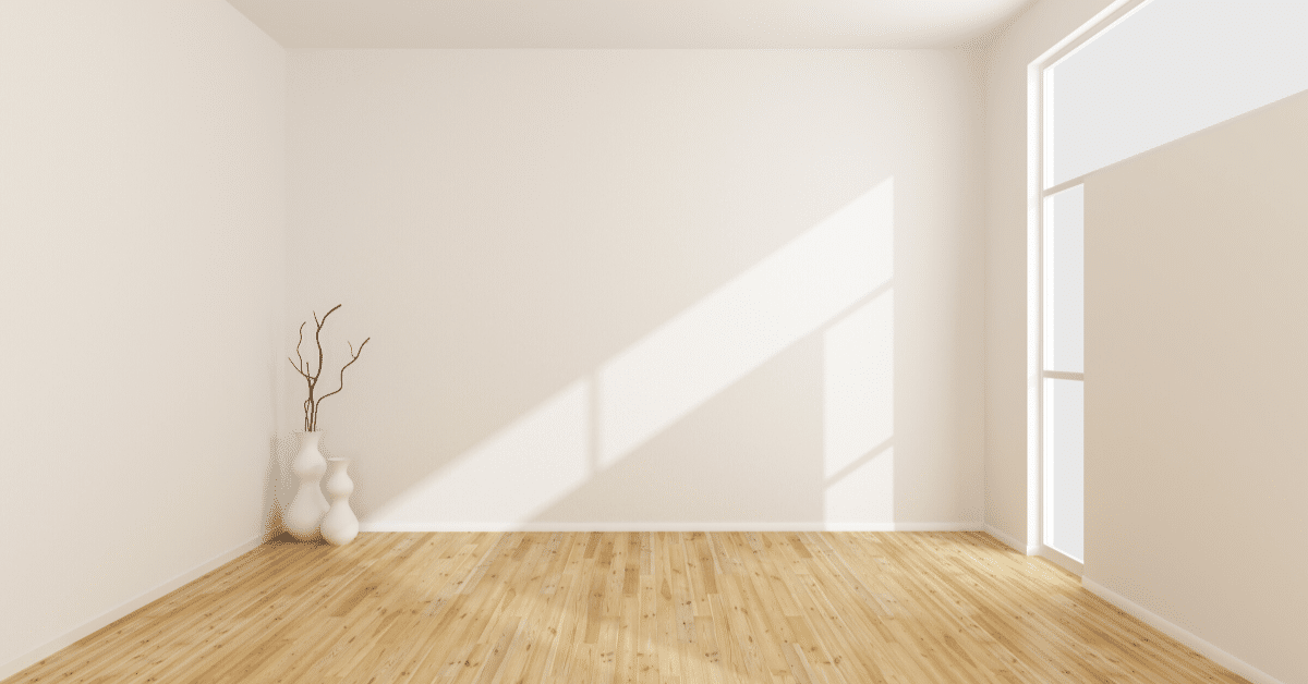 empty white room with wooden floors