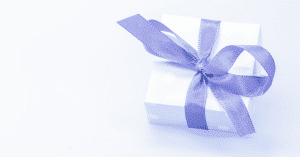 gift neatly tied using a purple ribbon
