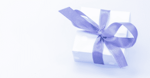 gift neatly tied using a purple ribbon