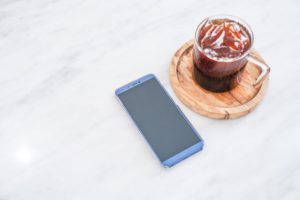 phone and coffee on the table