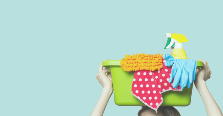 Bucket of cleaning supplies balanced on woman's head