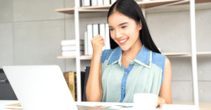 Happy woman at laptop