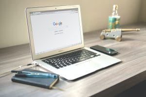 Laptop on desk with Google search