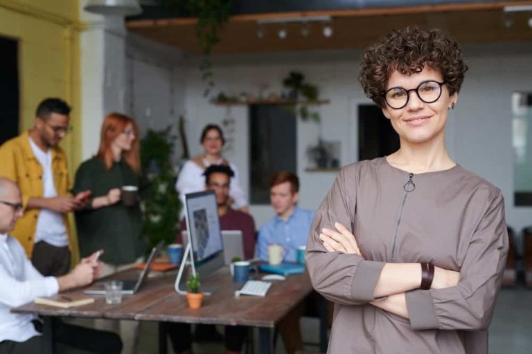 Female business owner with staff